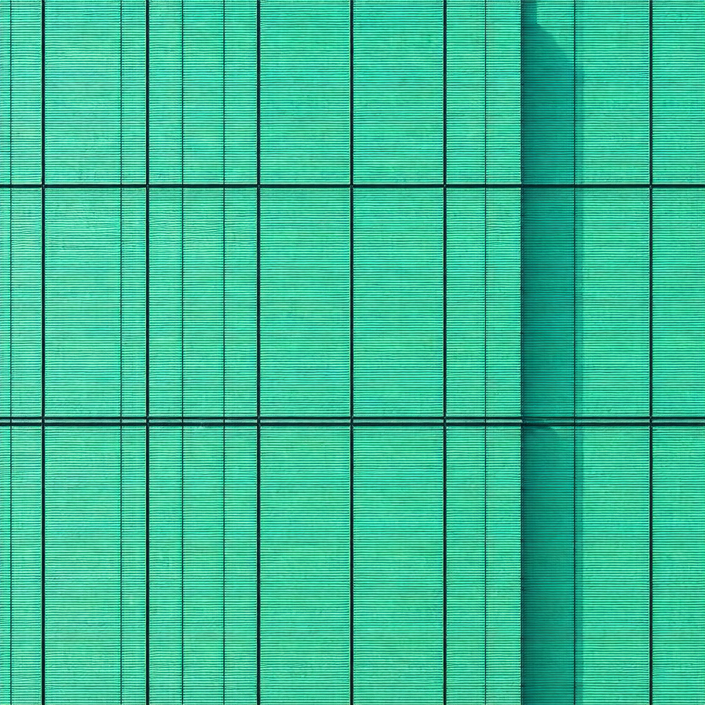 Large, bright green building with a distinctive blue shad...