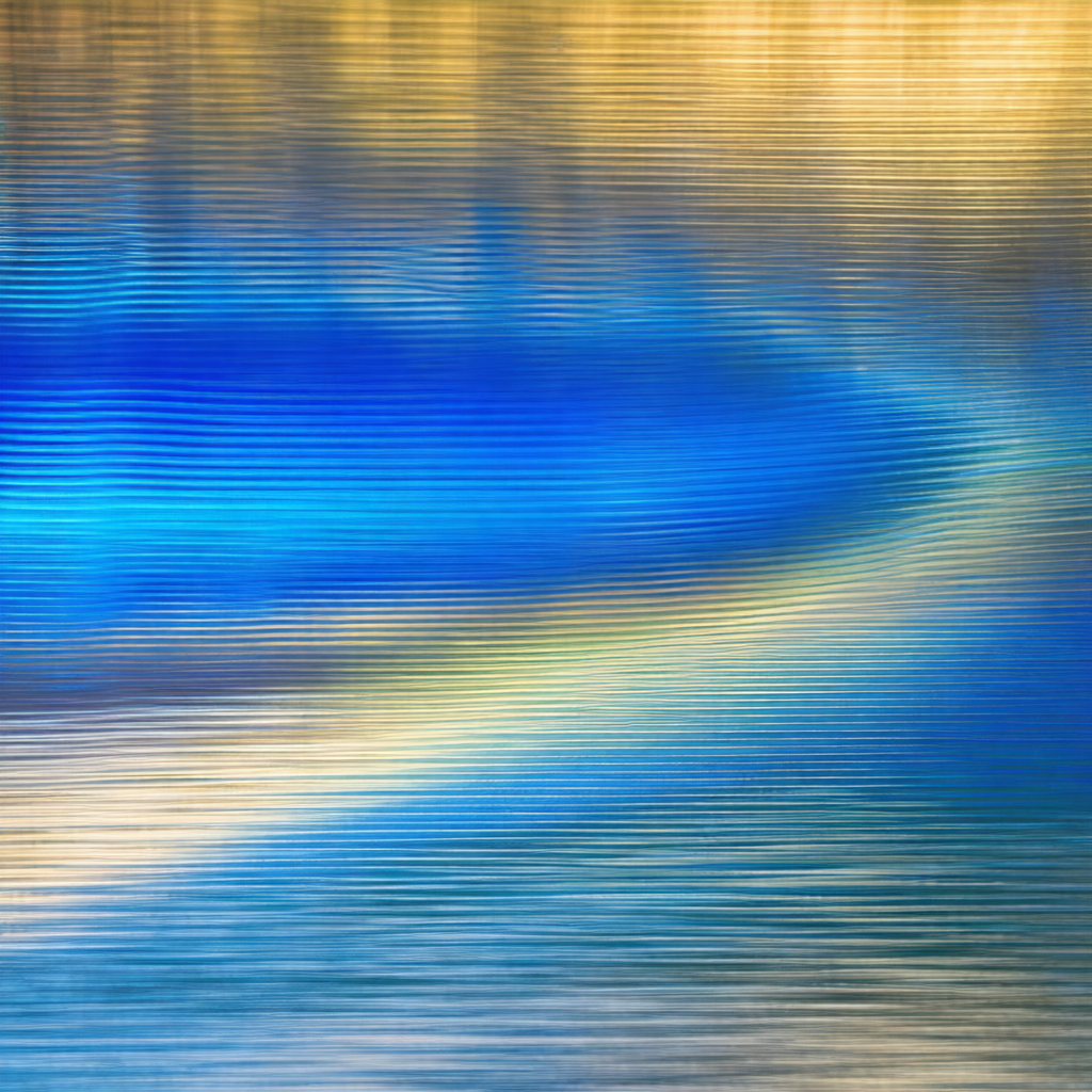 Body of water, possibly a lake or a river, with a blue hue
