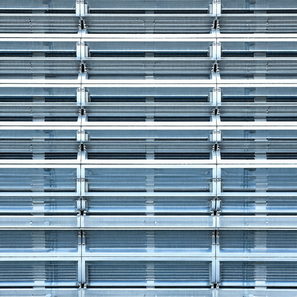 Large, blue metal structure with a row of silver bars
