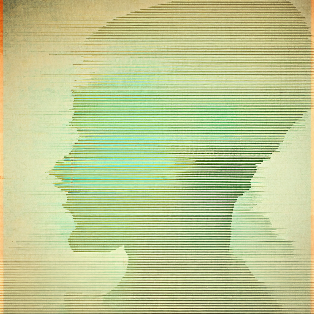 Close-up of a person's head, with a green background
