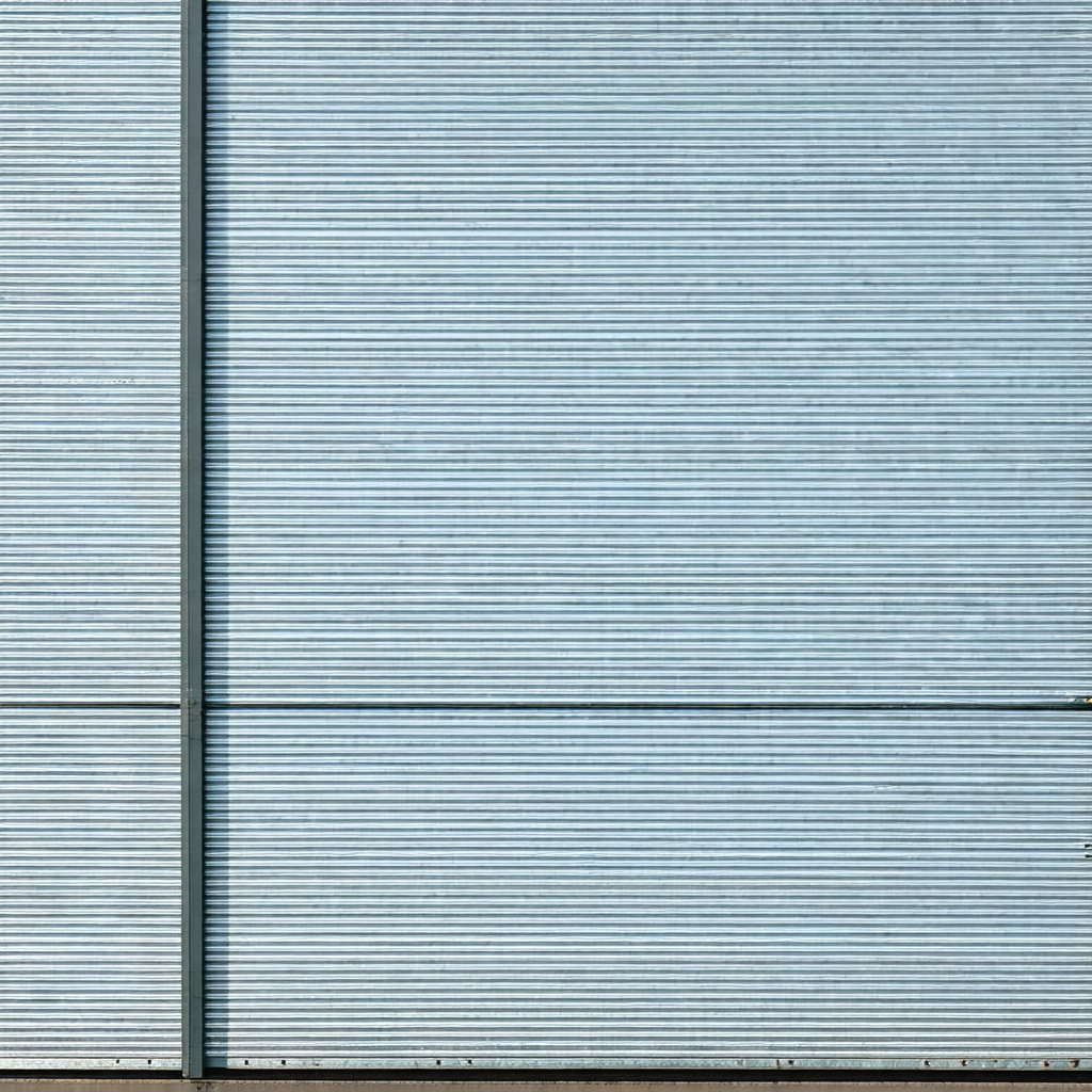 Large blue garage door with a metal frame