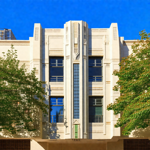 Large white building with a prominent clock tower