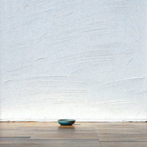 Blue bowl placed on a wooden floor