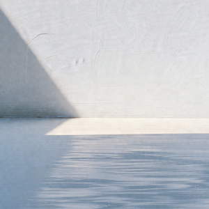 Large white wall with a shadow cast on it