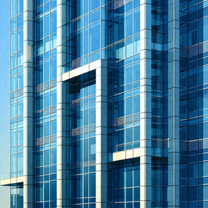 Tall, blue building with many windows