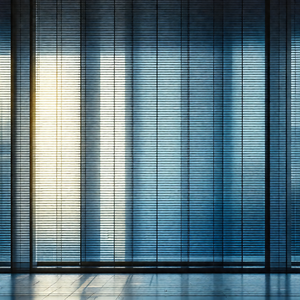 Large window with a blue tint, allowing sunlight to shine...