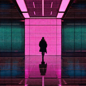 Person walking down a hallway in a building