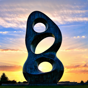 Urban Minimalist Design: Modern Sculpture With Sunset Glow With Large, Modern