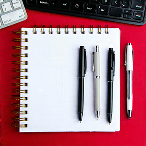 Business Professional Photography: Workplace With Notebooks And Pens On Desk With Desk Variety
